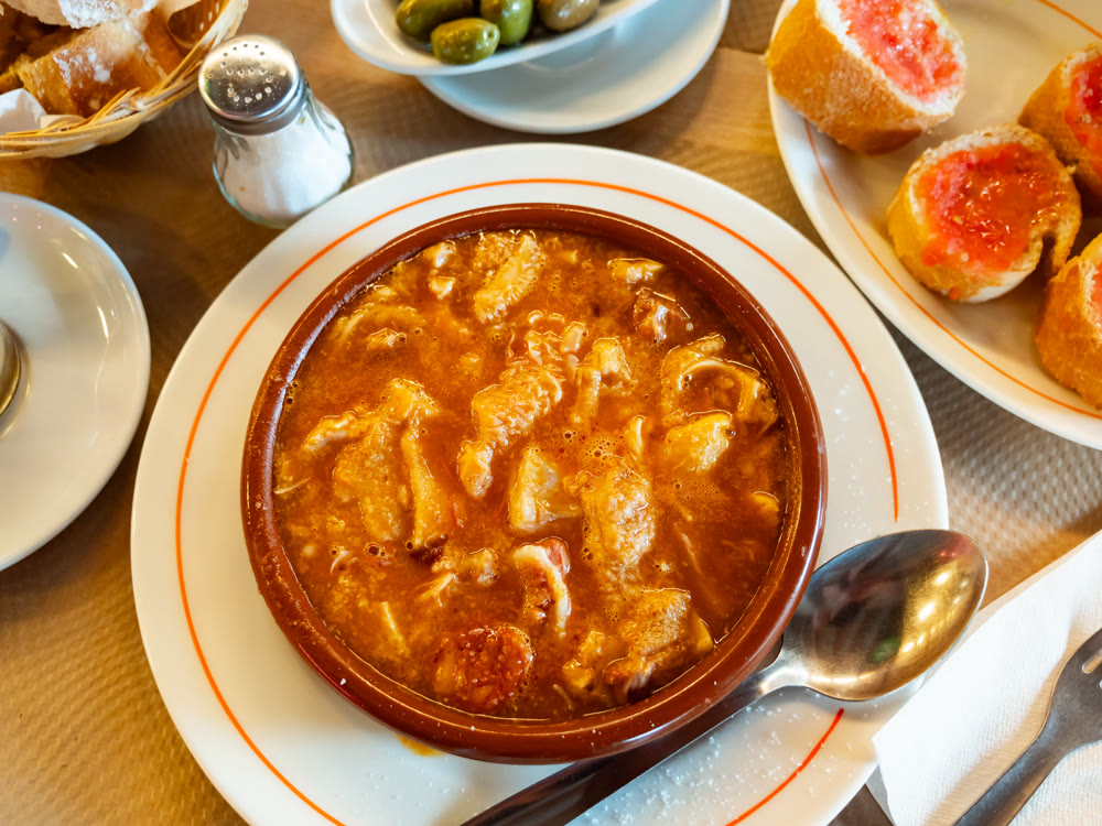 Portion of stewed tripe is cooked in plate - stomach of cattle