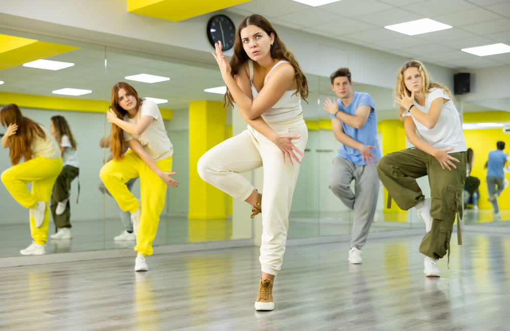 Young girl dancing modern dance in studio