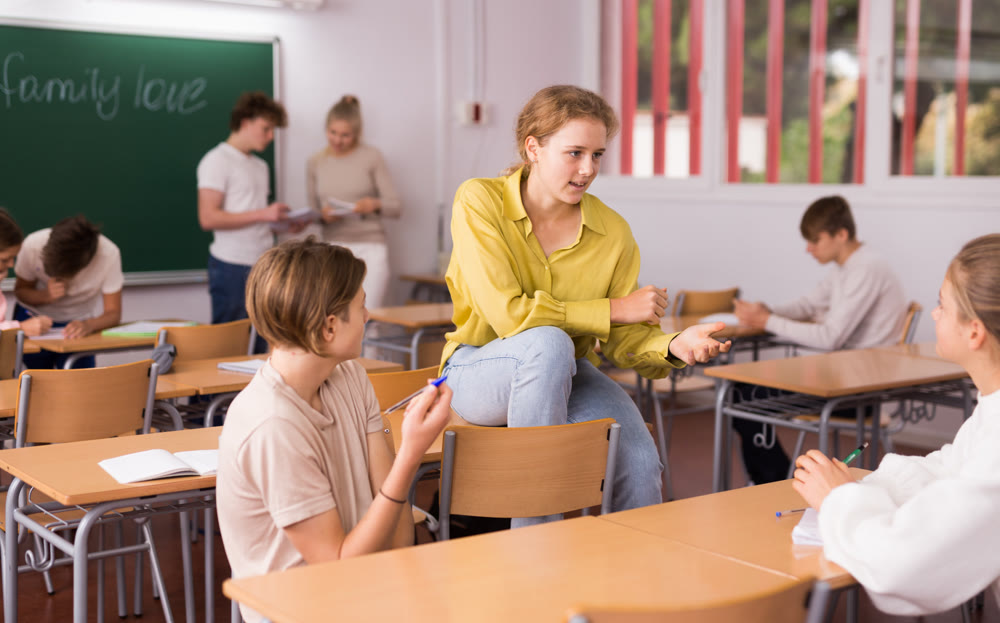 Teenagers during recess in classroom