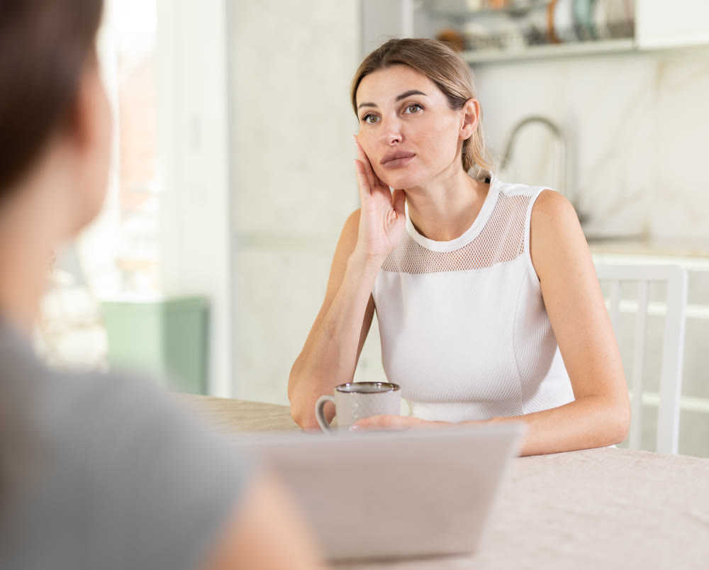 An insurance agent tells young girl the terms of property and life insurance