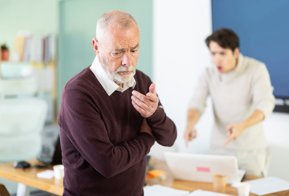 Outraged senior man turned his back on angry and shouting man boss.