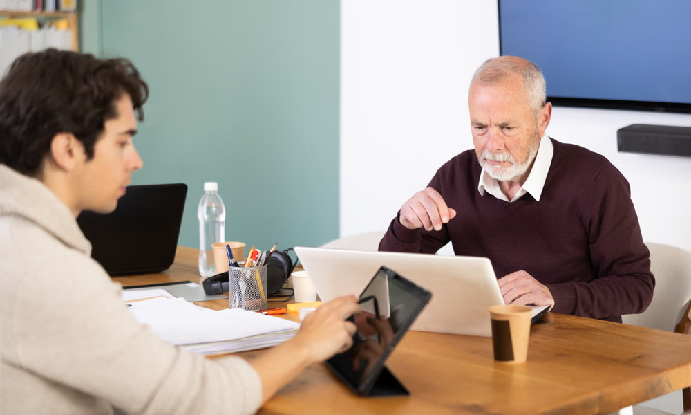 Office male employees working with laptop or computer