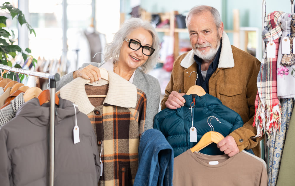 Senior couple with lot of goods in hands