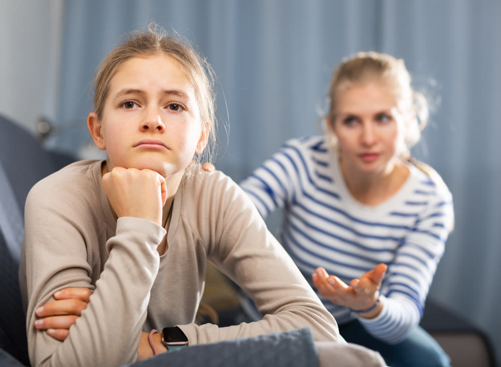 Sad teen girl after discord with her mother