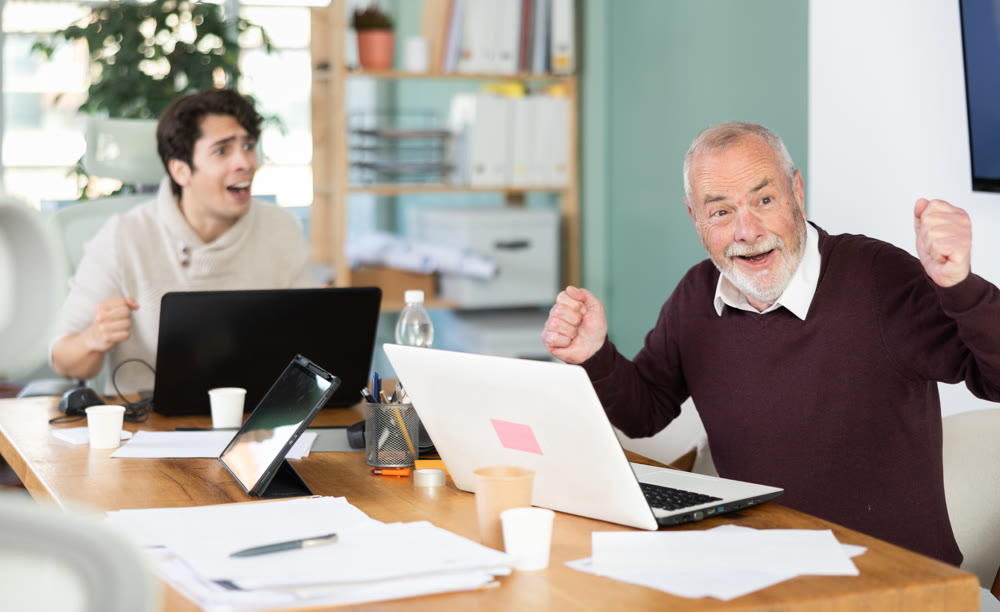Men office employees is genuinely happy and elated