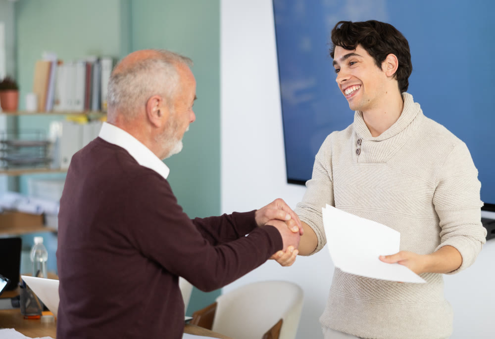 Confirmation of successful business negotiations with kind handshake, businessperson shaking hands and closing deal