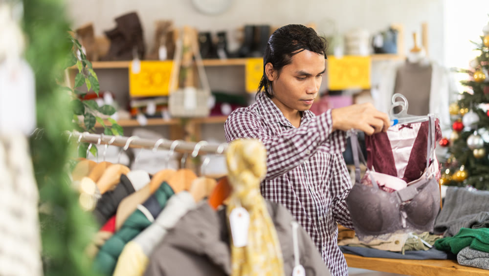 In chain shop, Indonesian man choose ladys lingerie bra, X mas shopping
