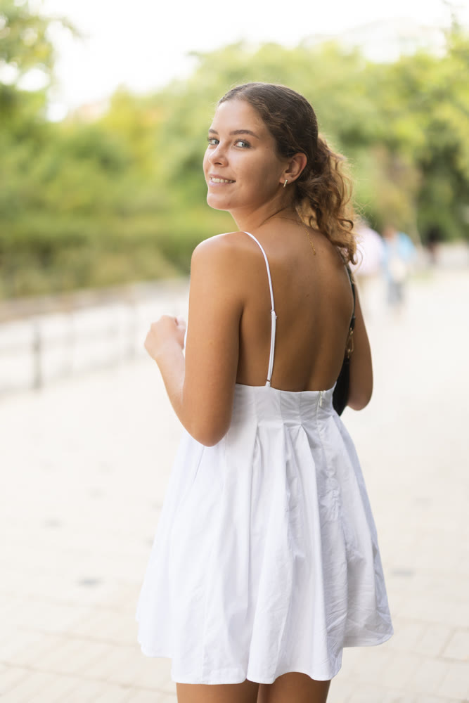 Young woman walking in city park
