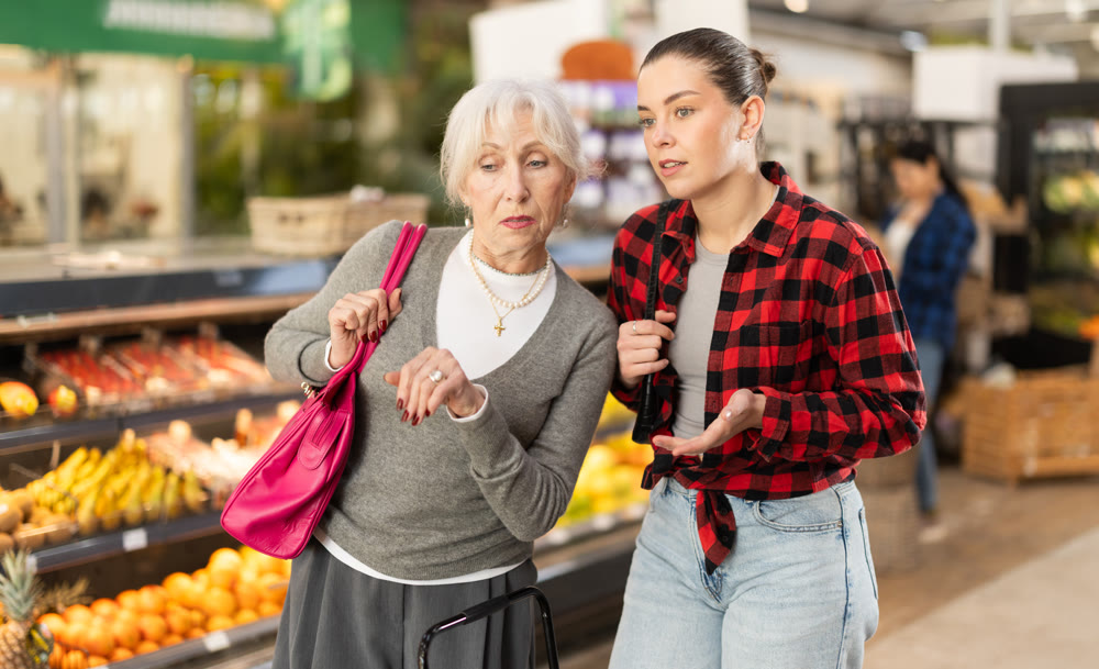 Family shopping at supermarket - choosing something in grocery section of supermarket