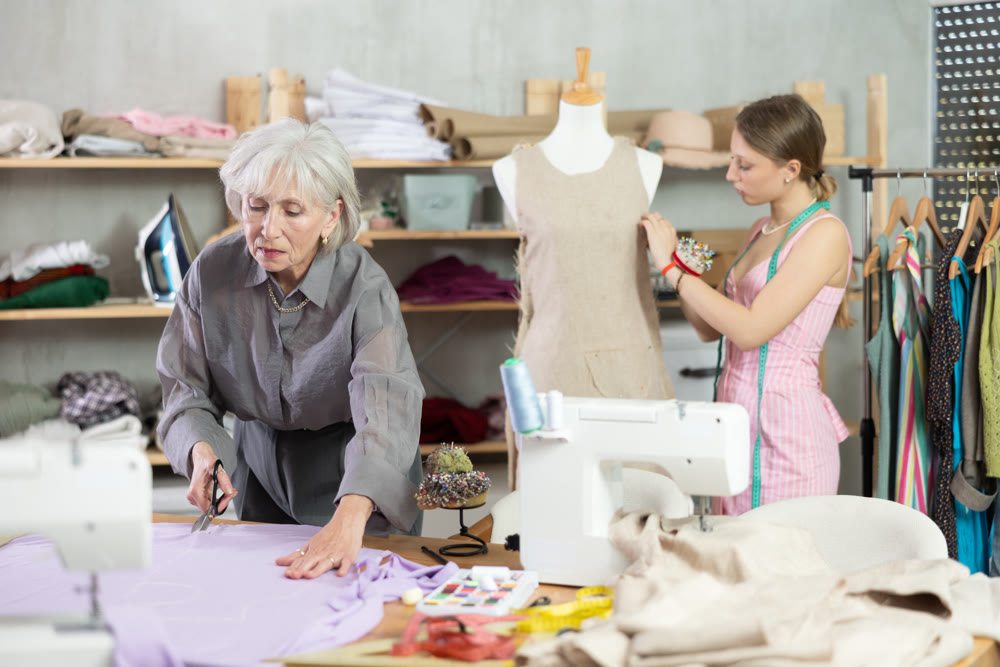 Woman Tailor Cuts Material