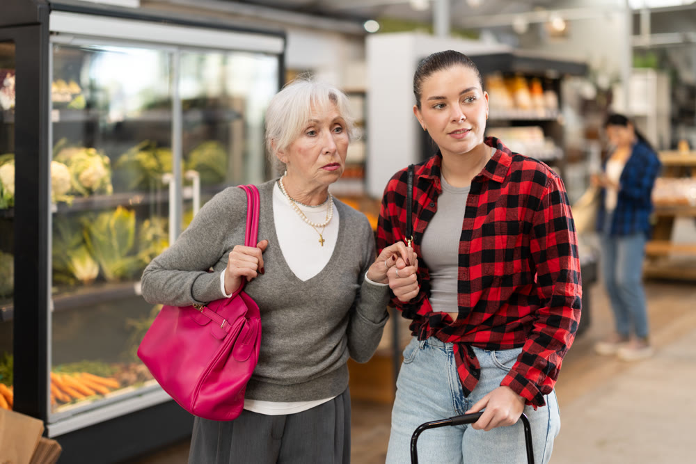 Family shopping at supermarket - choosing something in grocery section of supermarket