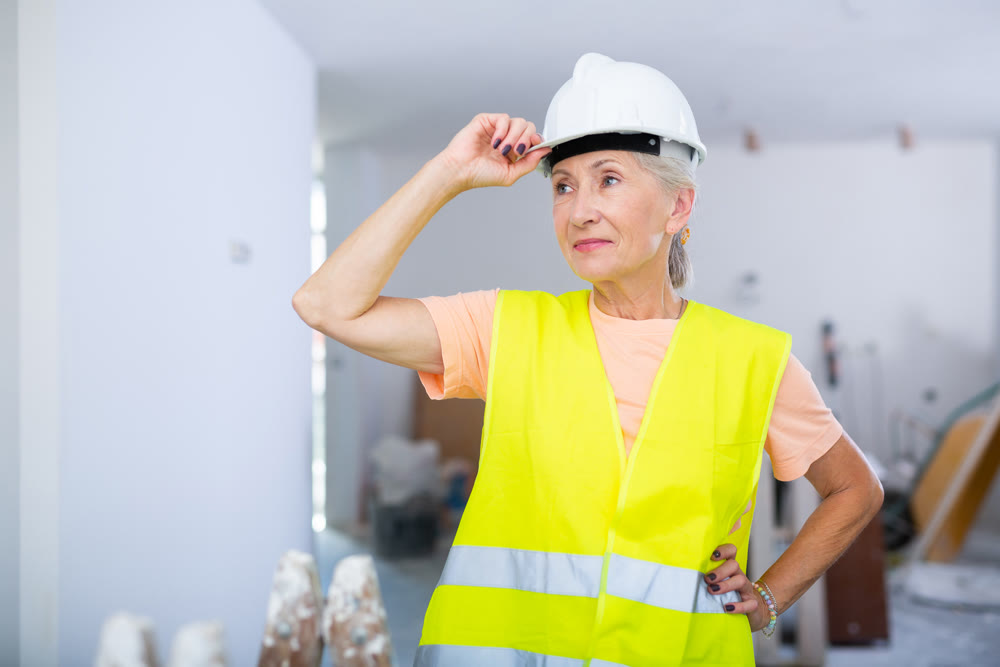 Mature woman architect in house being renovated