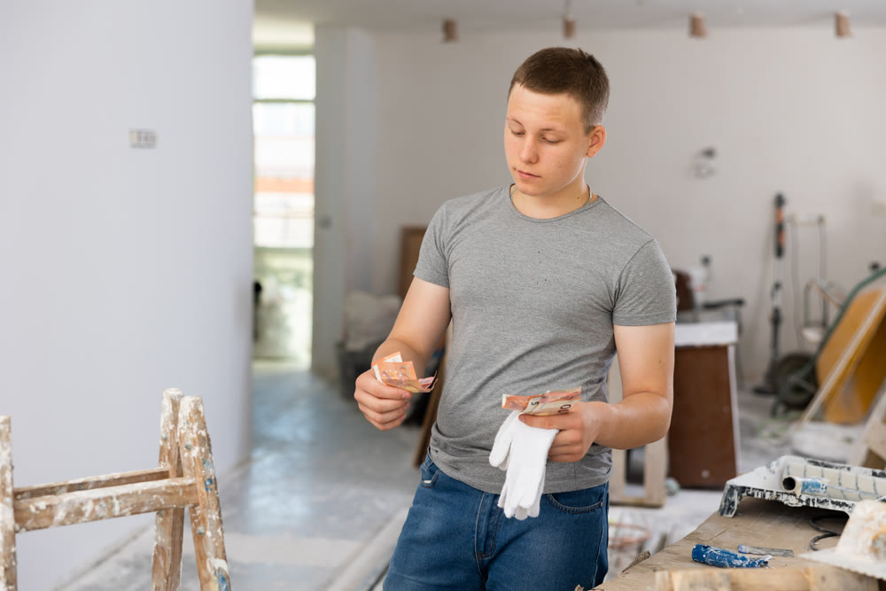 Fifteen-year-old teenager counting the first salary