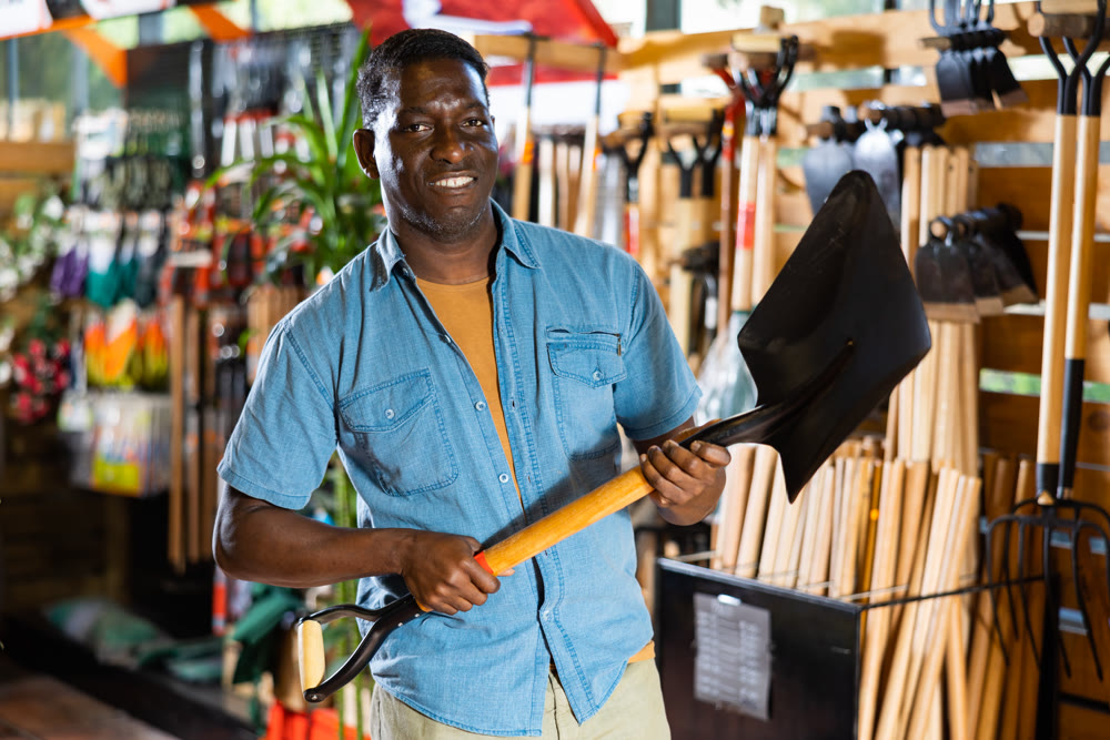 Portrait of an african american man choosing working tools