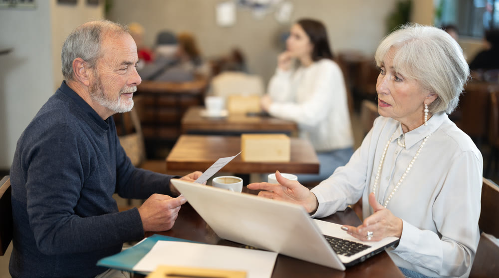Mature couple spend time in cafe