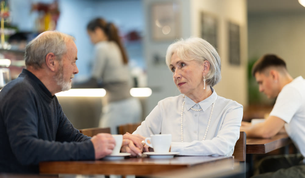 Elderly couple on a date in a cafe
