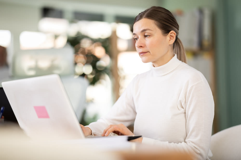 Middle aged woman working in a team in an office