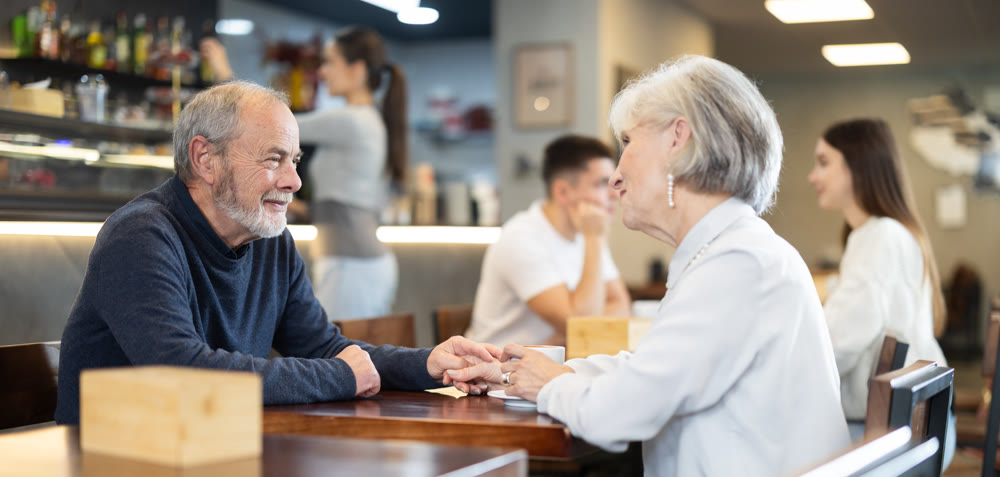 Elderly couple on a date in a cafe