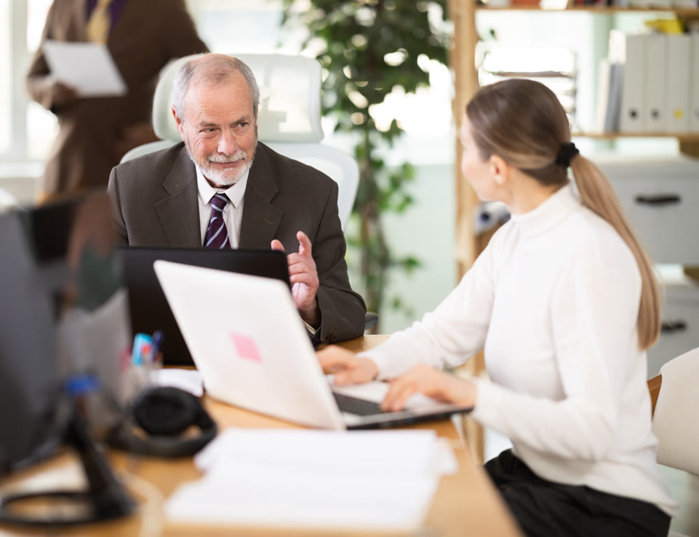 Office employee working with laptop or computer, negotiating, calling with partners