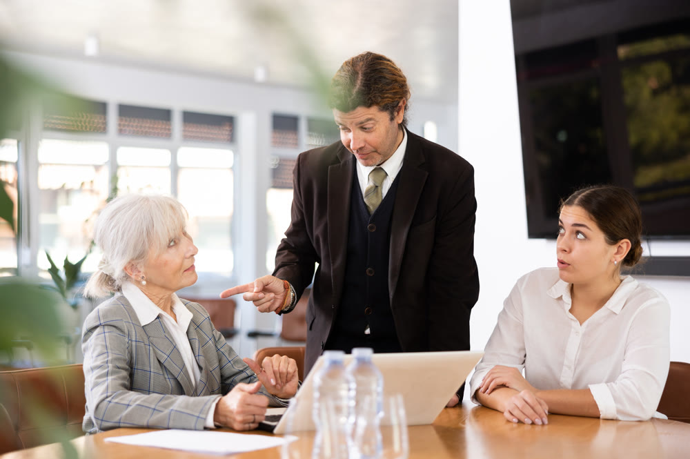 Businessman discussing project during work meeting with colleagues