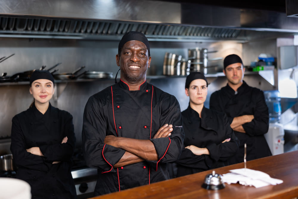 Team of chefs with man head chef
