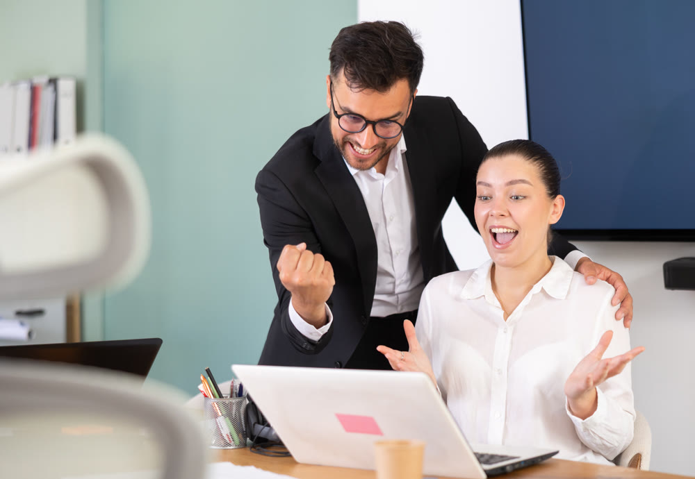 Happy managers celebrate business success. Winning stock exchange bid
