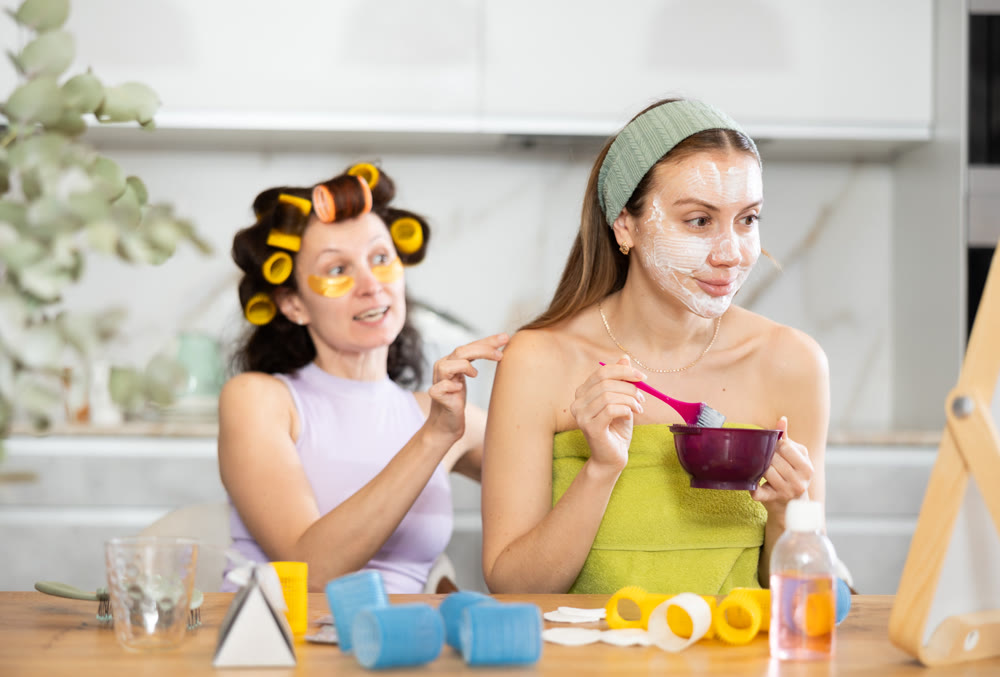 Female friends having pampering day, sharing skincare tips