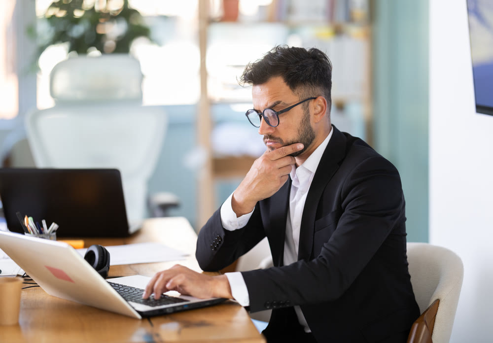 Businessman work on laptop in modern company office