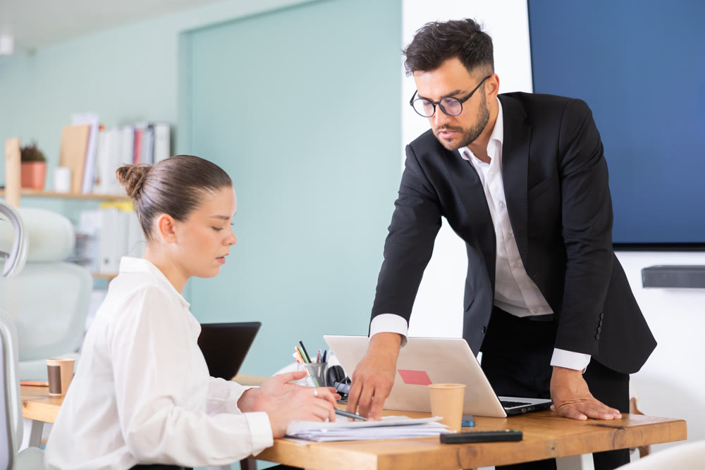 Guy and girl office employees read and process documents