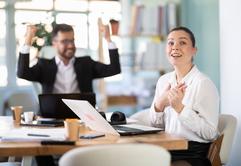 Man and girl office employees is genuinely happy and elated