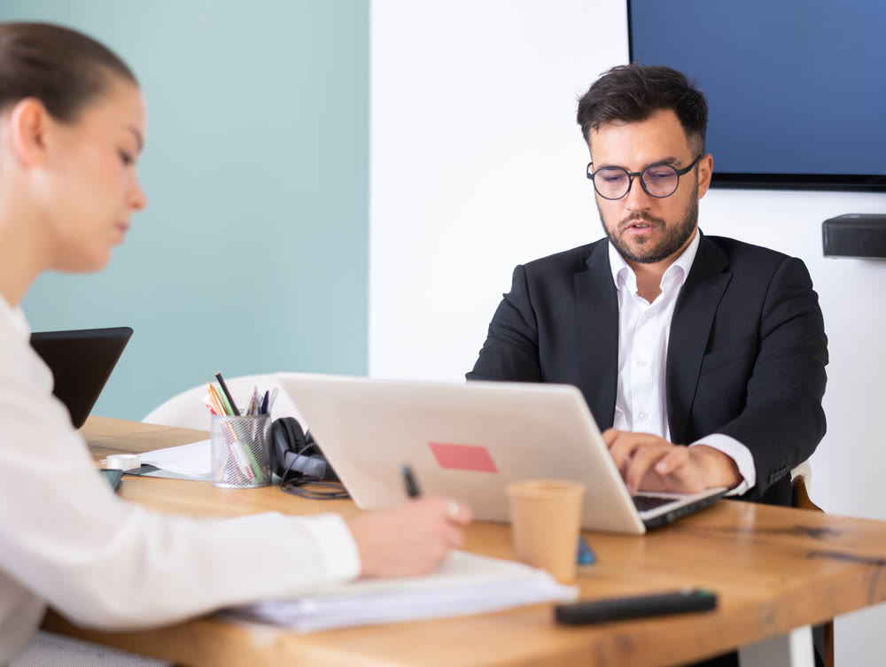 professionals working in a successful company, sit at a table
