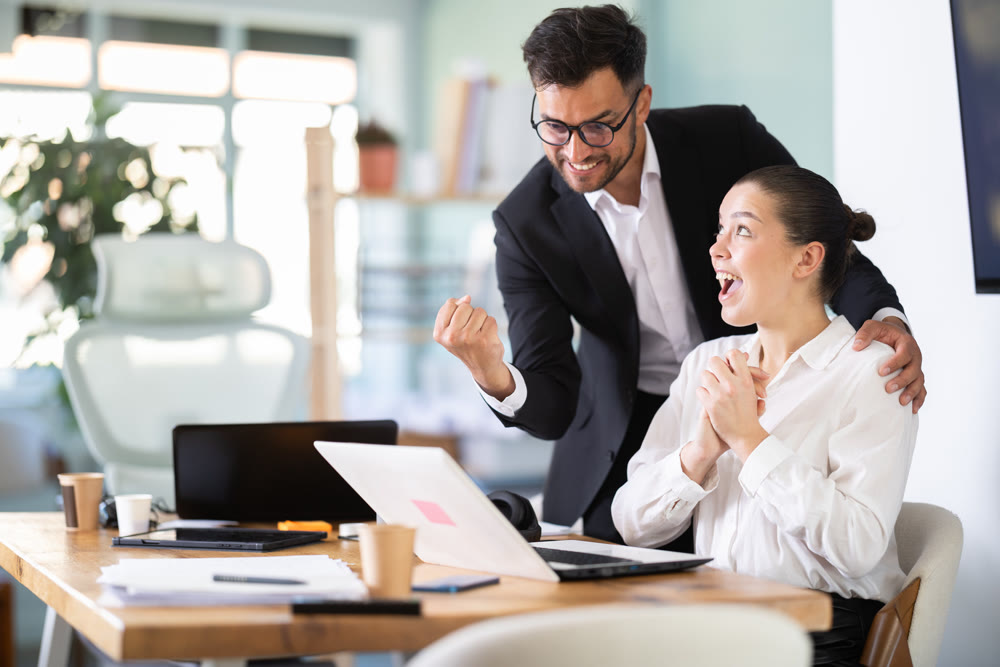 Man and girl office employees is genuinely happy and elated