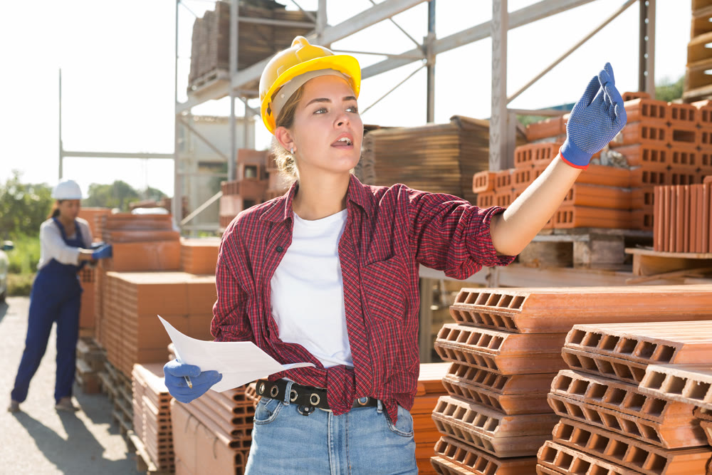 Female worker beckoning come here at construction store