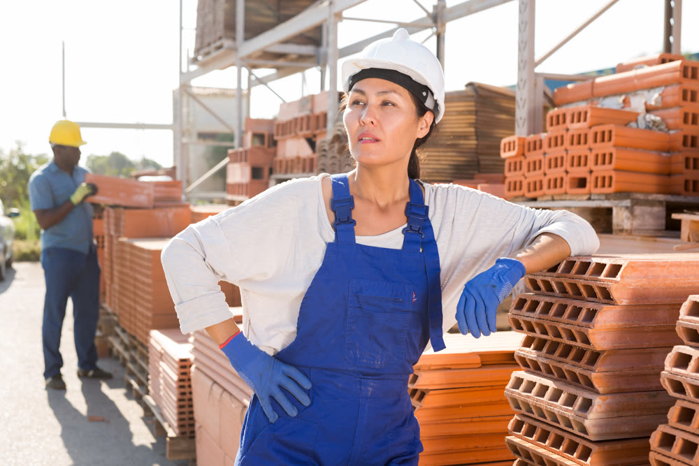 Asian woman worker posing at hardware store