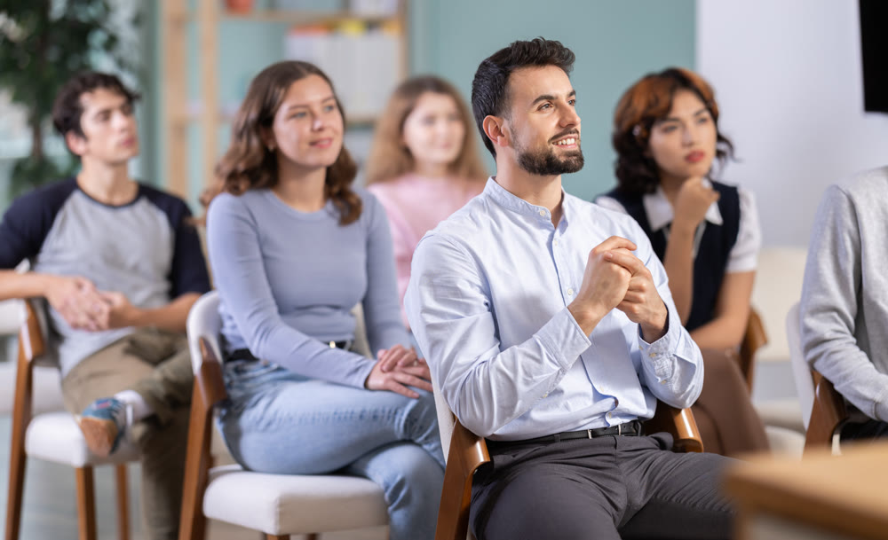 Students sit attentively in the classroom and listen to lectures