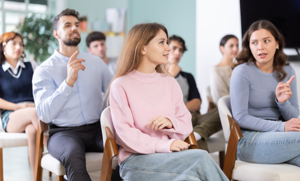Young people are listening to lecture in auditorium