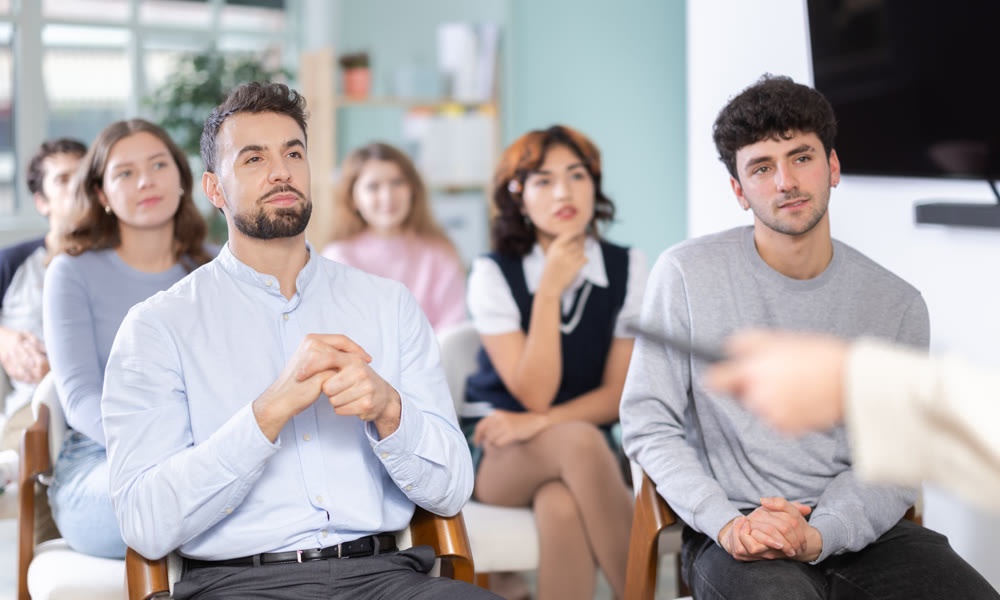 Students sit attentively in the classroom and listen to lectures