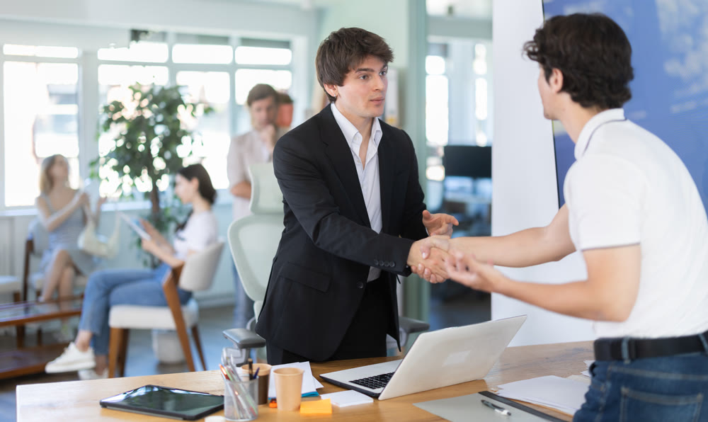 Bank manager talking with male client in office