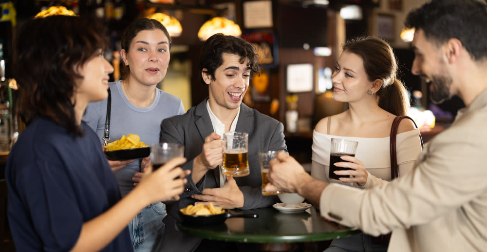 Young people spend time at bar