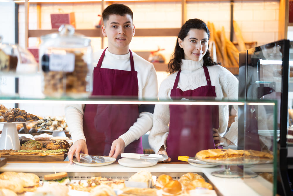 Young woman and man at cafe window