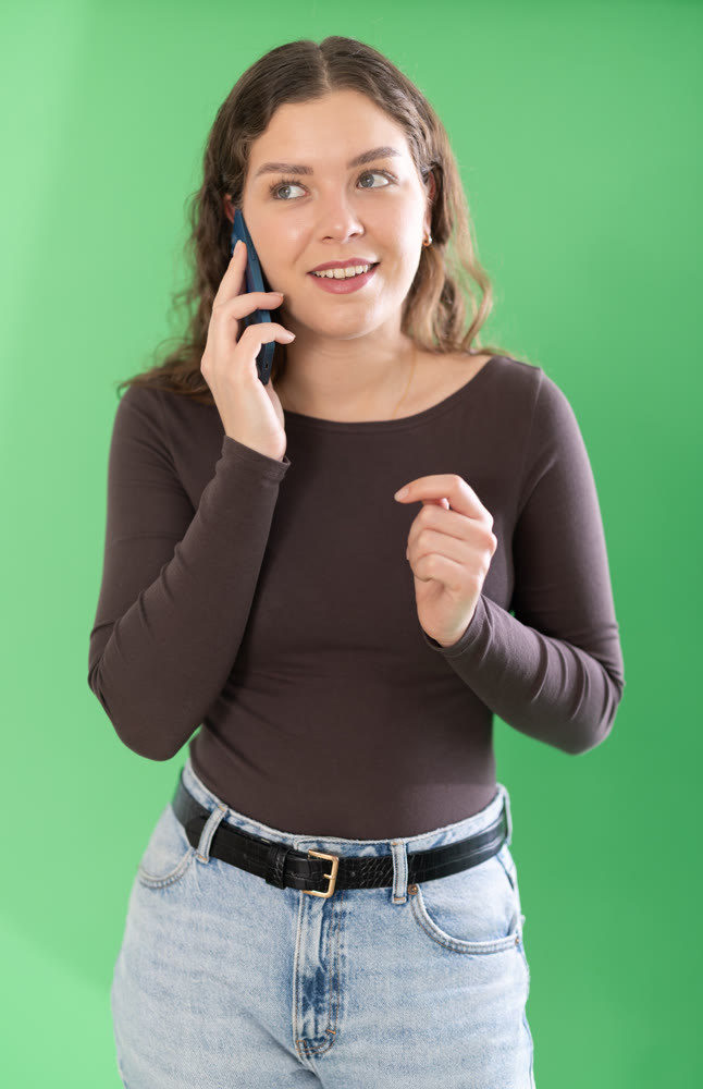 Female person is talking on phone