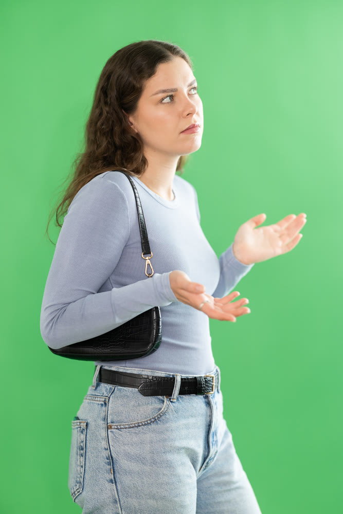 Discouraged or puzzled female person is trying to recall necessary information