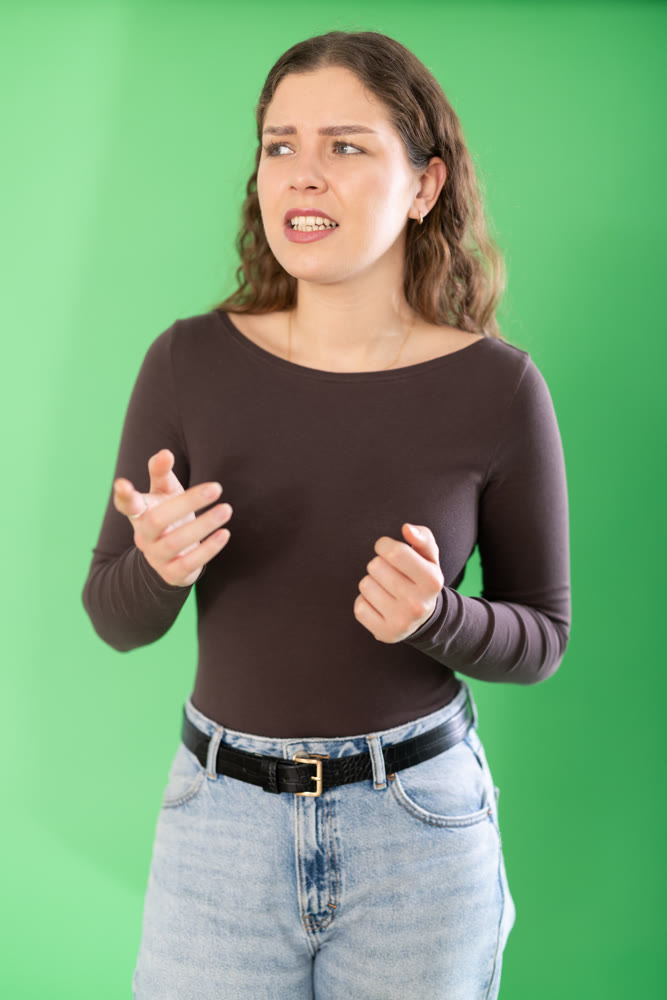 Outraged European young woman is yelling at someone
