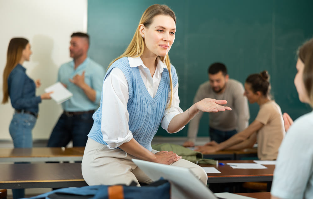 Two positive female students communicate with each other