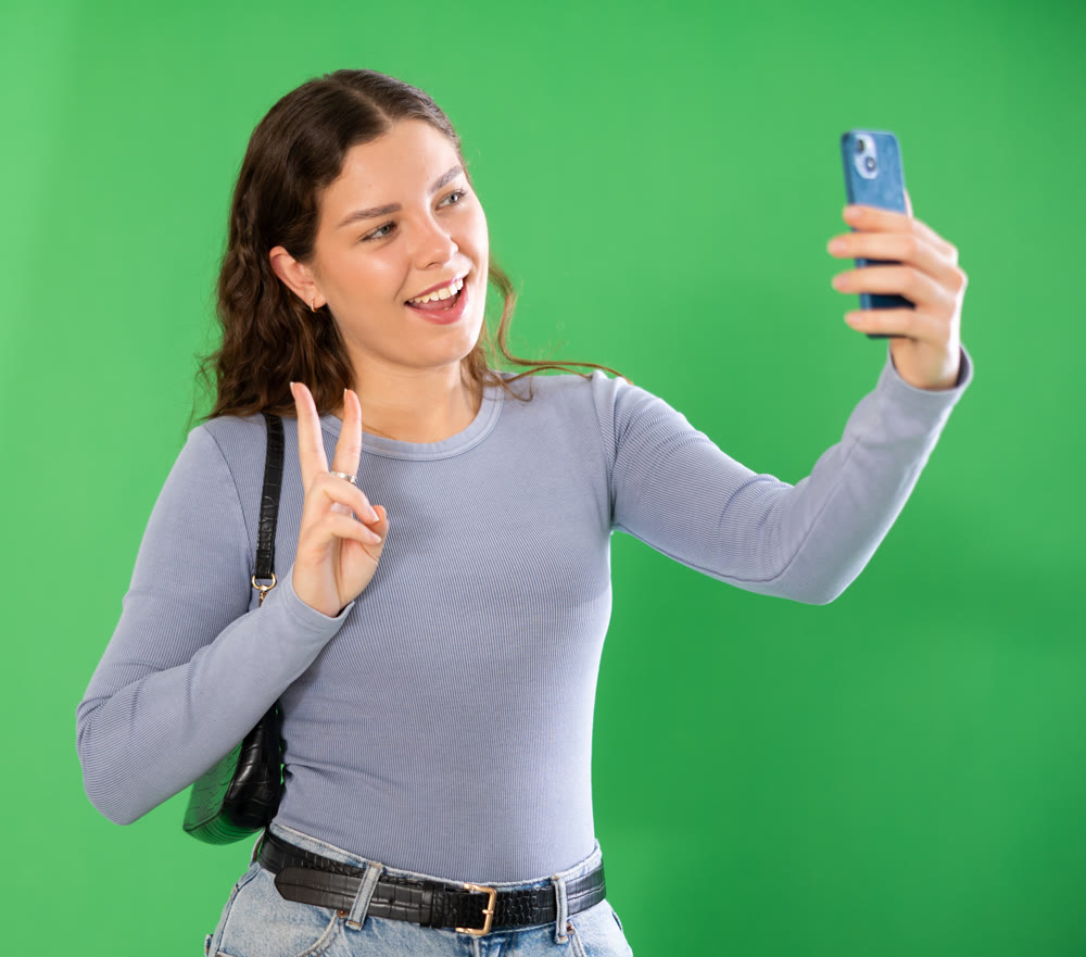 Girl takes selfie, captures herself in significant moment