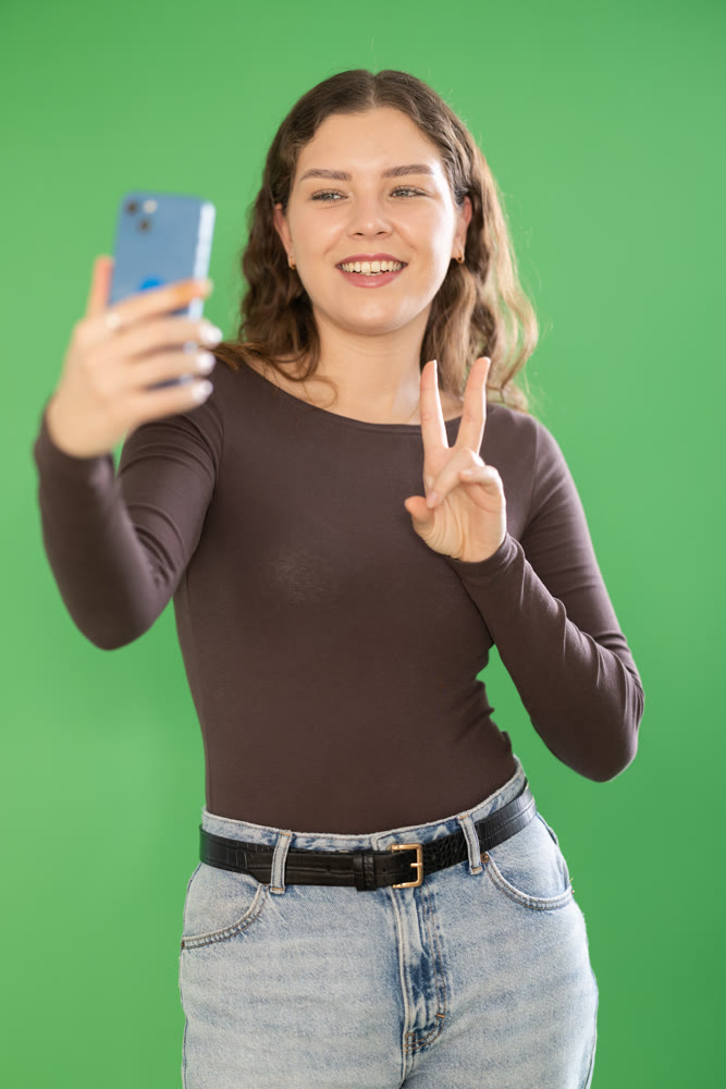 Girl takes selfie, captures herself in significant moment