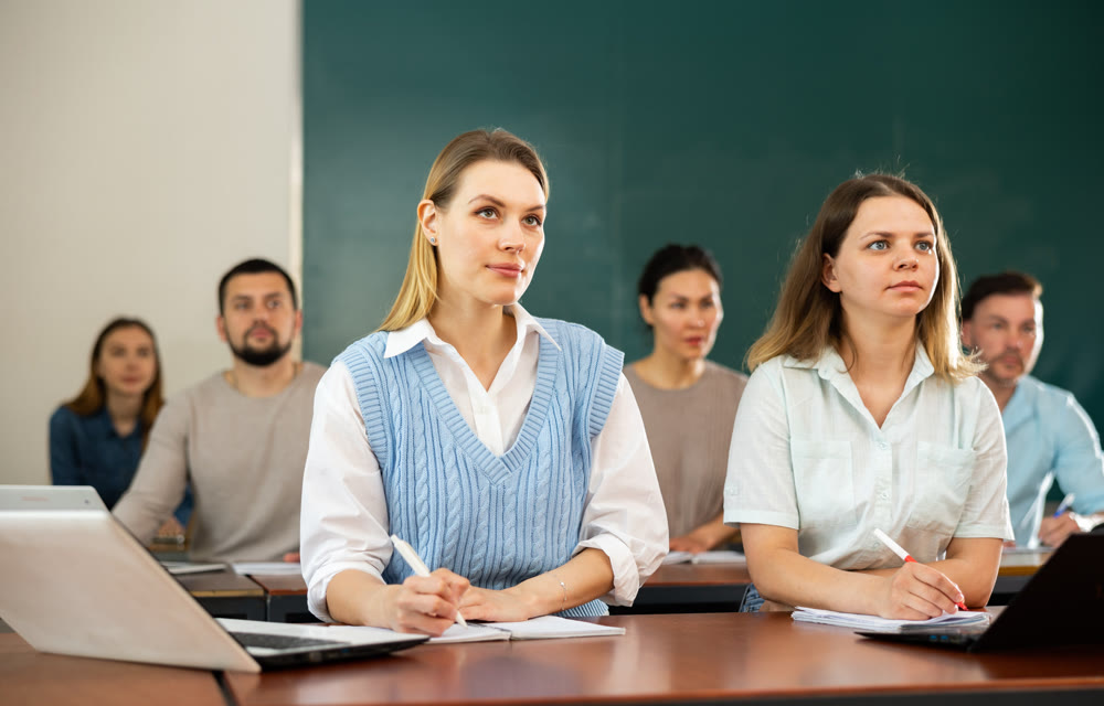 Group of different age students at extension courses in lecture room