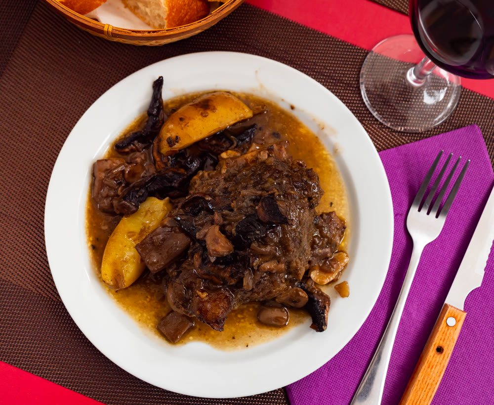 Stew made with pork meat, potatoes, and mushrooms in thick gravy.
