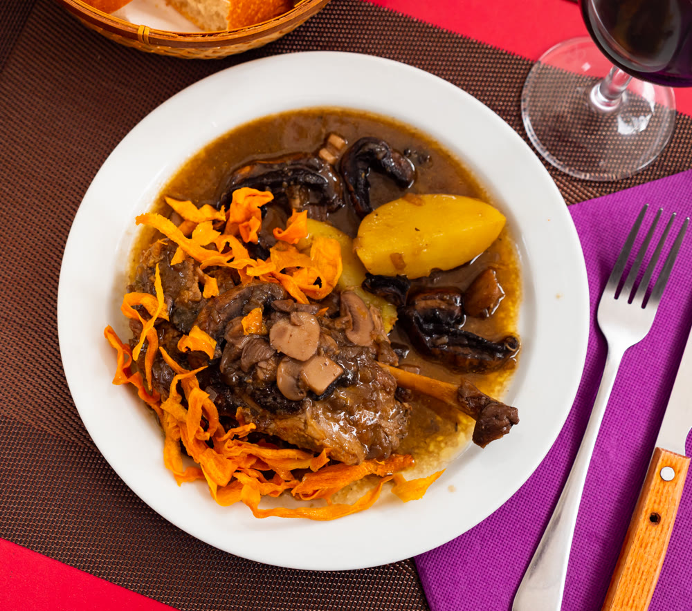 Stew made with pork meat, potatoes, and mushrooms in thick gravy.