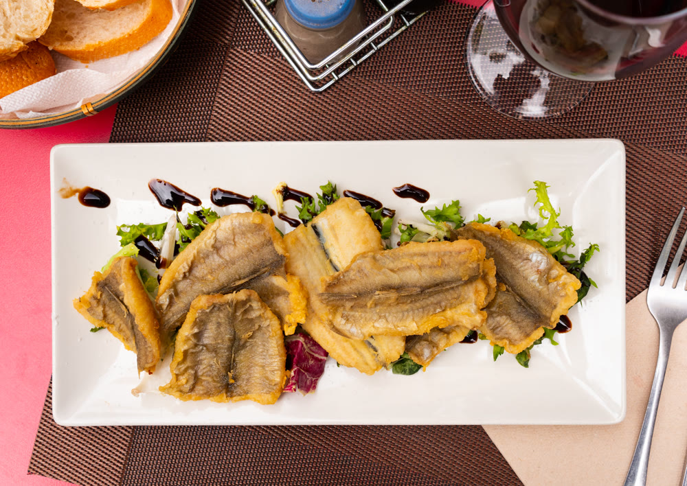 Mairas la andaluza is a traditional Andalusian dish. Cod is coated in flour and fried in plenty of olive oil until crispy crust forms